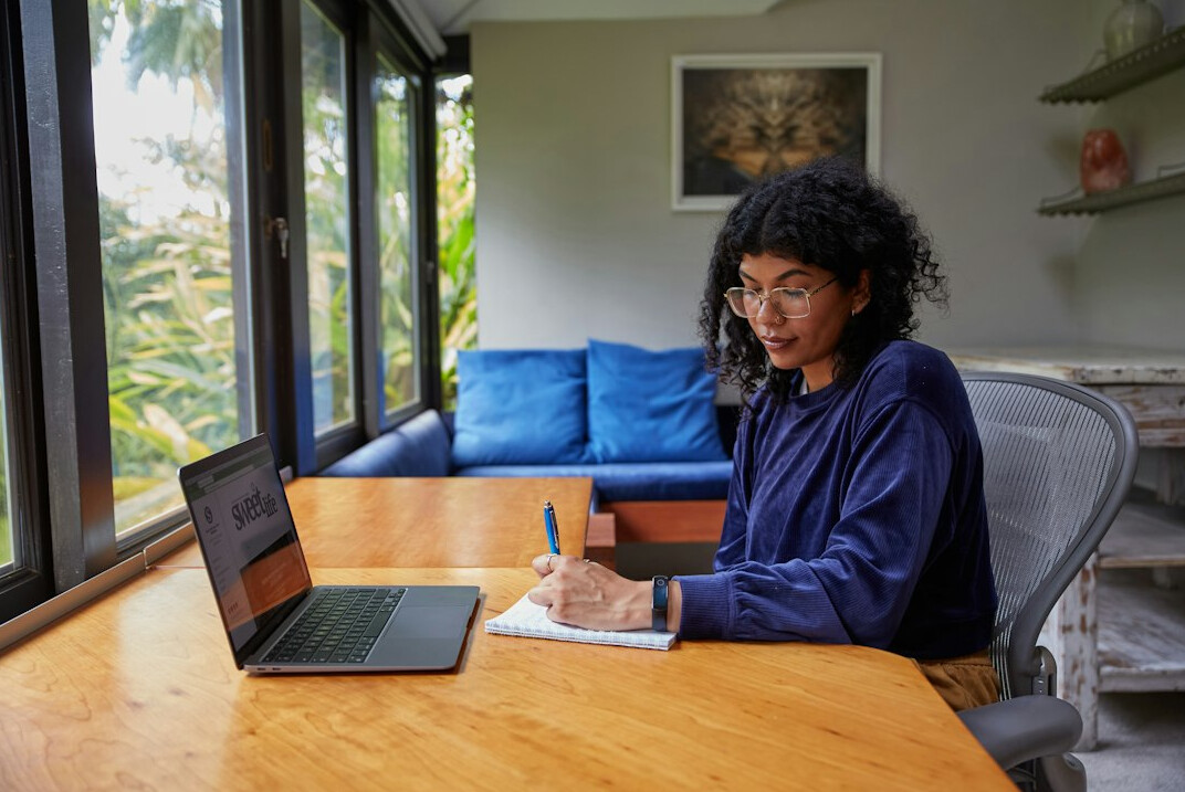 writer at desk with notebook